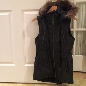 Black vest with faux fur around hood
